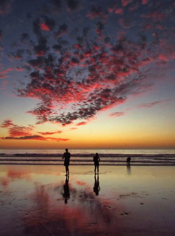 two person standing on shore